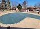 Large community pool featuring a safety cover for seasonal use and nearby community structures at 12520 W Virginia Ave, Lakewood, CO 80228