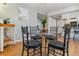 Cozy dining area featuring a glass-top table, seating for four, and stylish decor at 12520 W Virginia Ave, Lakewood, CO 80228