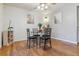 Inviting dining area with hardwood floors, modern decor, and a ceiling fan for added comfort at 12520 W Virginia Ave, Lakewood, CO 80228