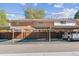 Exterior view of townhomes with carports and parking at 12520 W Virginia Ave, Lakewood, CO 80228