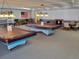 Fun game room with pool tables, table tennis, a foosball table, and comfortable seating at 12520 W Virginia Ave, Lakewood, CO 80228