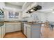 Well-equipped kitchen featuring a breakfast bar, modern appliances, and ample natural light, perfect for cooking at 12520 W Virginia Ave, Lakewood, CO 80228