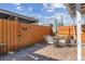 Outdoor patio with stone pavers, dining set, and a wood fence surround at 12520 W Virginia Ave, Lakewood, CO 80228