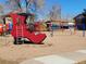 Fun community playground with a Cinderella shoe and other play structures at 12520 W Virginia Ave, Lakewood, CO 80228