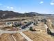 A picturesque aerial view of residential construction homes featuring mountain views and natural surroundings at 14422 Pansy Loop, Morrison, CO 80465
