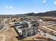 An aerial view of new residential construction homes with a lake, mountain views and natural surroundings at 14422 Pansy Loop, Morrison, CO 80465