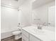 Full bathroom with white cabinets, modern sink, shower and mirror in a well-lit and neutral-toned space at 14422 Pansy Loop, Morrison, CO 80465