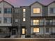 Modern townhome showcases varied textures and private front patios at 14422 Pansy Loop, Morrison, CO 80465