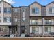 Modern townhome showcases varied textures and private front patios at 14422 Pansy Loop, Morrison, CO 80465