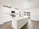 Modern kitchen features an island, stainless appliances and mountain views at 14422 Pansy Loop, Morrison, CO 80465