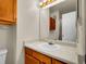 Bathroom features a white countertop, cabinet, and a well-lit mirror at 1094 S Dearborn St # 301, Aurora, CO 80012
