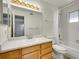 Bathroom with white countertop, cabinets, mirror, and shower with curtain at 1094 S Dearborn St # 301, Aurora, CO 80012