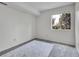 Bedroom with carpet and a bright window with views of trees at 1094 S Dearborn St # 301, Aurora, CO 80012