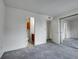 Bright bedroom with carpet, and access to the bathroom and closet at 1094 S Dearborn St # 301, Aurora, CO 80012