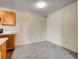 Versatile empty room features neutral carpeting and space for customization, ideal for dining at 1094 S Dearborn St # 301, Aurora, CO 80012