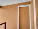 Close-up of front door number 307 and yellow horizontal siding at 1094 S Dearborn St # 301, Aurora, CO 80012