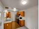 Kitchen features stainless steel appliances and warm wood cabinets at 1094 S Dearborn St # 301, Aurora, CO 80012