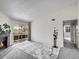 Bright living room featuring a cozy fireplace, neutral carpet, and sliding glass doors to a balcony at 1094 S Dearborn St # 301, Aurora, CO 80012