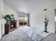 Bright living room featuring a cozy fireplace, neutral carpet, and sliding glass doors to a balcony at 1094 S Dearborn St # 301, Aurora, CO 80012