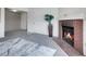 Comfortable living room showcasing a classic fireplace and neutral carpeting leading to another room at 1094 S Dearborn St # 301, Aurora, CO 80012
