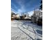 Snowy backyard featuring a shed and glimpses of neighboring houses beyond a bare, wintry tree line at 2060 S Washington St, Denver, CO 80210