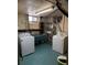 Basement laundry with washer, dryer, sink, and storage at 2060 S Washington St, Denver, CO 80210