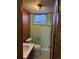 Basement bathroom featuring a vanity, toilet, and tiled flooring at 2060 S Washington St, Denver, CO 80210