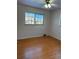 This is a nice bedroom with hardwood floors and natural light at 2060 S Washington St, Denver, CO 80210