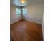 This is a nice bedroom with hardwood floors and natural light at 2060 S Washington St, Denver, CO 80210