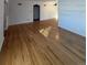 Living room with hardwood floors and neutral-toned walls with decorative molding at 2060 S Washington St, Denver, CO 80210