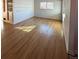 Living room with hardwood floors, large windows, and neutral walls with trim detailing at 2060 S Washington St, Denver, CO 80210