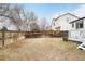 Backyard with hammock and wooden fence at 9506 Castle Ridge Cir, Highlands Ranch, CO 80129