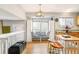 Kitchen with breakfast nook, white cabinets, and wood-toned island at 9506 Castle Ridge Cir, Highlands Ranch, CO 80129