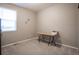 A cozy bedroom with neutral walls, carpet, desk and lots of natural light at 7108 Morrison Dr, Frederick, CO 80530