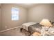 Cozy bedroom with neutral tones and a window providing natural light at 7108 Morrison Dr, Frederick, CO 80530