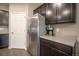 Modern kitchen showcasing stainless steel refrigerator, dark wood cabinets, and sleek countertops at 7108 Morrison Dr, Frederick, CO 80530