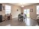 Inviting dining area with a wooden table, dark wood floors, and sliding glass doors leading to the backyard at 7108 Morrison Dr, Frederick, CO 80530