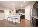 Stylish kitchen with a large island, bar seating, and modern stainless steel appliances at 7108 Morrison Dr, Frederick, CO 80530
