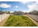 Expansive backyard with lush lawn, patio, and privacy fence, perfect for outdoor gatherings at 7108 Morrison Dr, Frederick, CO 80530