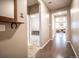 Inviting hallway with wood floors leads to other rooms in the house, decorated with rustic accents at 7108 Morrison Dr, Frederick, CO 80530
