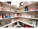 Well-stocked pantry featuring ample shelving for optimal organization and storage at 7108 Morrison Dr, Frederick, CO 80530