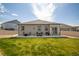 Landscaped backyard featuring a cozy fire pit, seating and a built in grill at 7108 Morrison Dr, Frederick, CO 80530
