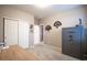 Bedroom with a closet, large gun safe, and purple door to an additional room at 7108 Morrison Dr, Frederick, CO 80530
