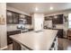Well-equipped kitchen with stainless steel appliances, dark cabinetry, and a central island with bar stool seating at 7108 Morrison Dr, Frederick, CO 80530