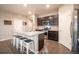 Spacious kitchen featuring a central island with seating, stainless steel appliances, and ample cabinet space at 7108 Morrison Dr, Frederick, CO 80530