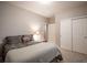 Cozy bedroom featuring a closet with sliding doors and a queen sized bed at 7108 Morrison Dr, Frederick, CO 80530