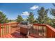 Backyard deck with a gas grill, and beautiful treed views, perfect for outdoor cooking and relaxation at 7716 Shenandoah Dr, Elizabeth, CO 80107