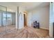 Bedroom featuring large closet doors, neutral colored walls and carpet, and a street view at 7716 Shenandoah Dr, Elizabeth, CO 80107