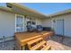 Cozy outdoor deck with seating, accessed by steps with brick walkway to house door at 7716 Shenandoah Dr, Elizabeth, CO 80107