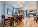 Inviting dining room adjacent to the kitchen with hardwood floors and ample natural light at 7716 Shenandoah Dr, Elizabeth, CO 80107